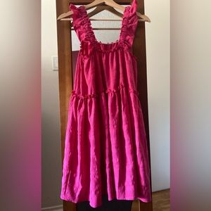 Pink loose fitting summer dress, knee length.